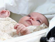 KING'S LYNN, ENGLAND - JULY 05: Princess Charlotte of Cambridge is pushed in her silver cross pram as she leaves the Church of St Mary Magdalene on the Sandringham Estate after her Christening on July 5, 2015 in King's Lynn, England.